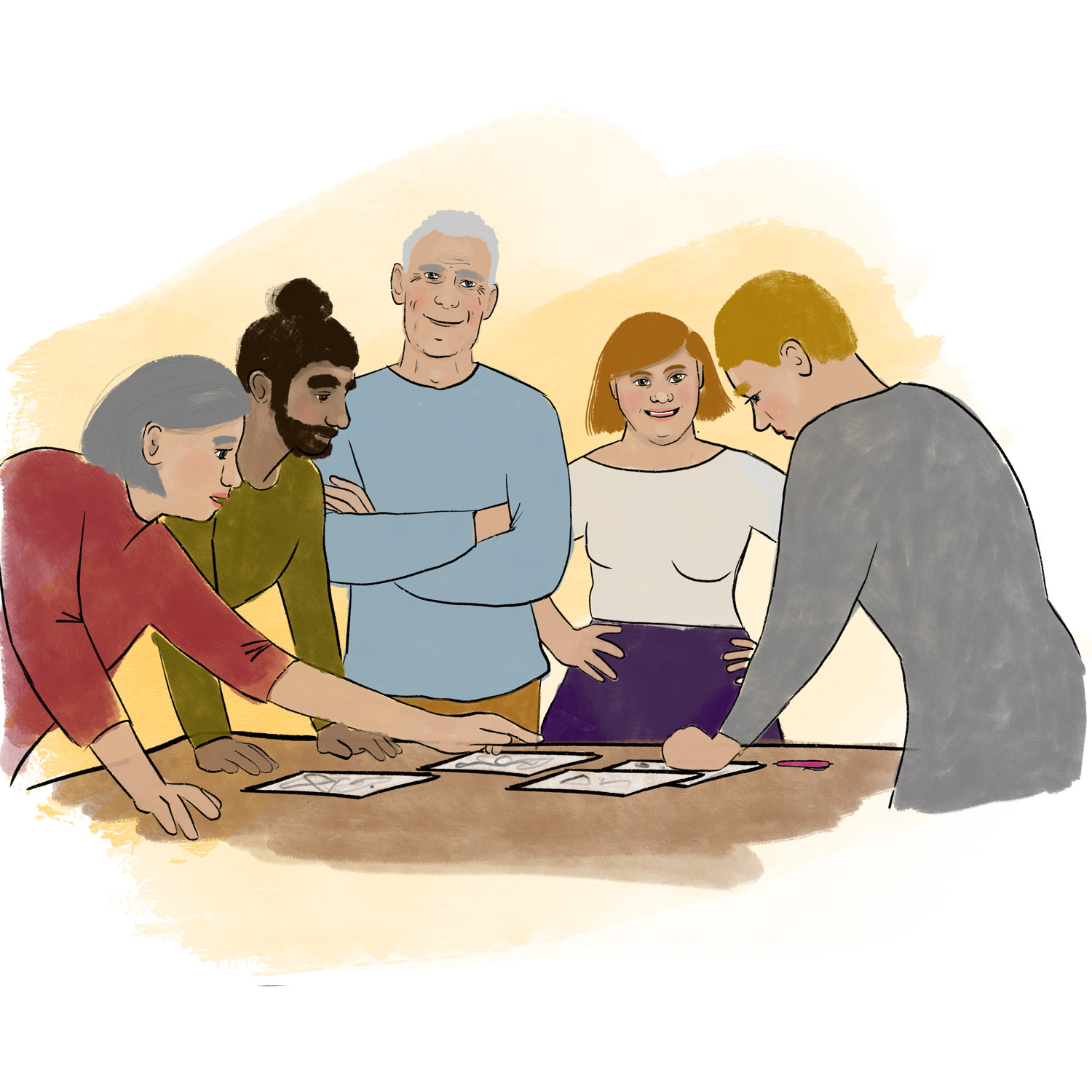 Mehrere Personen arbeiten zusammen an einem TIsch mit Papieren